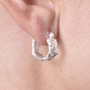 Culturesse Olli Textured Sculpture Huggie Earrings (Silver)